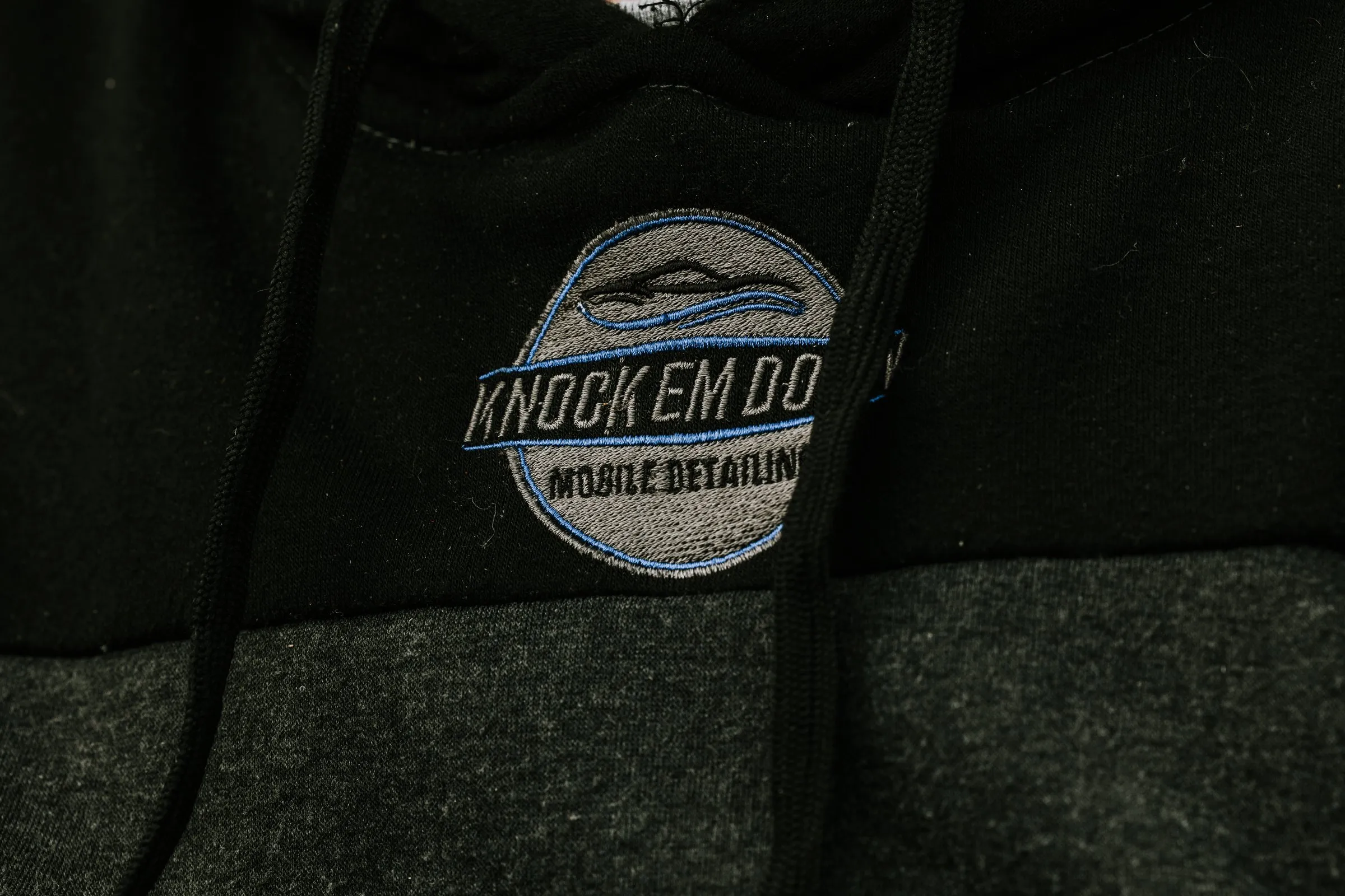Knock Em Down logo embroidered on a crew hoodie