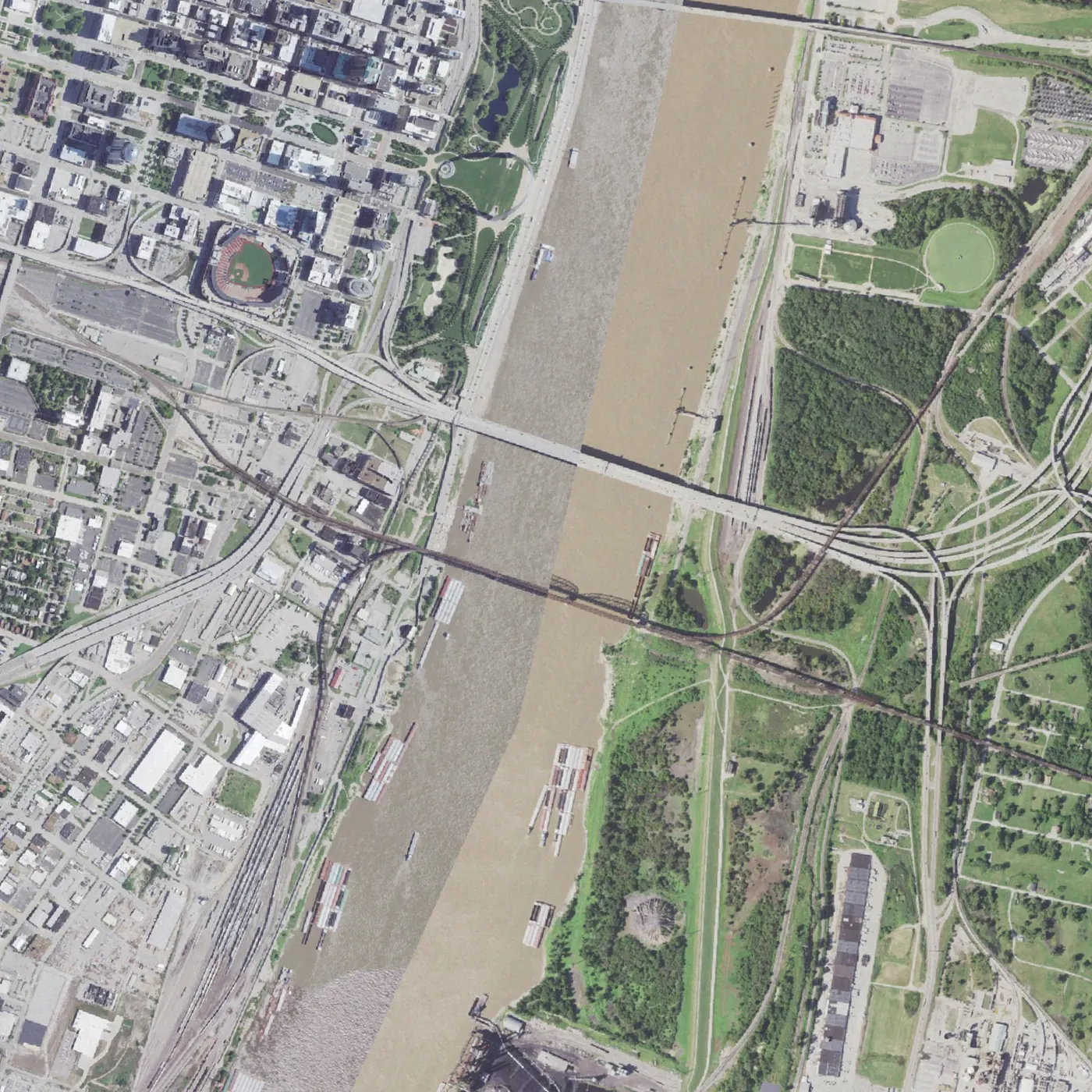 Aerial photograph of the Mississippi at St. Louis with the MacArthur crossing marked, the Gateway Arch and Busch Stadium labelled for orientation.