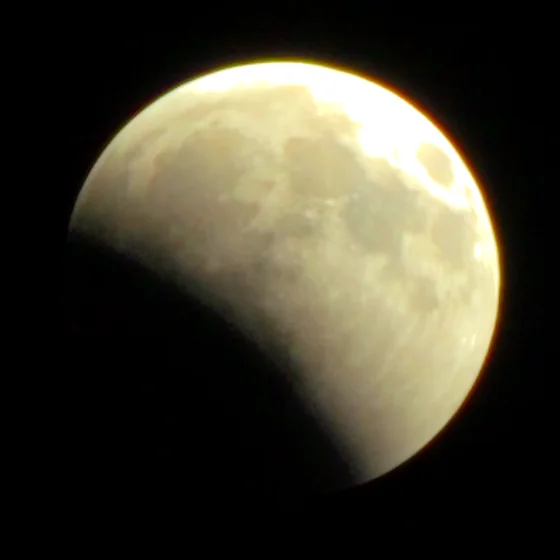 The moon at 21:54, a bite taken out of one limb.