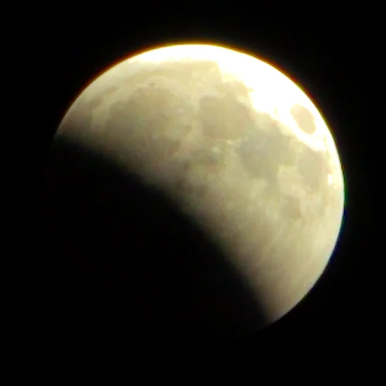 The moon at 22:01, a bite taken out of one limb.