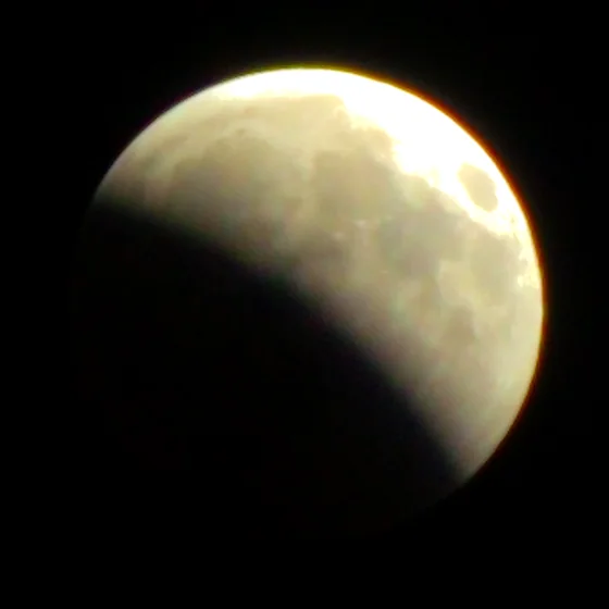 The moon at 22:05, a bite taken out of one limb.