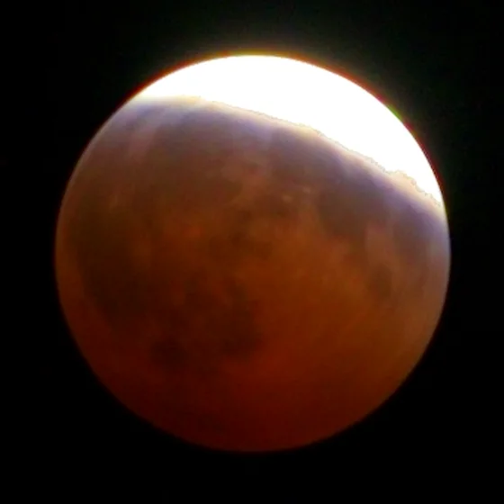 The moon at 22:40, most of the disc copper, a bright rind left.