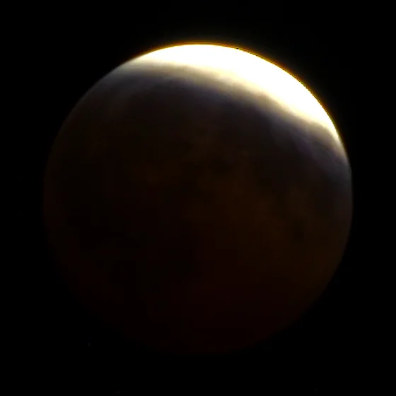 The moon at 22:44, most of the disc copper, a bright rind left.