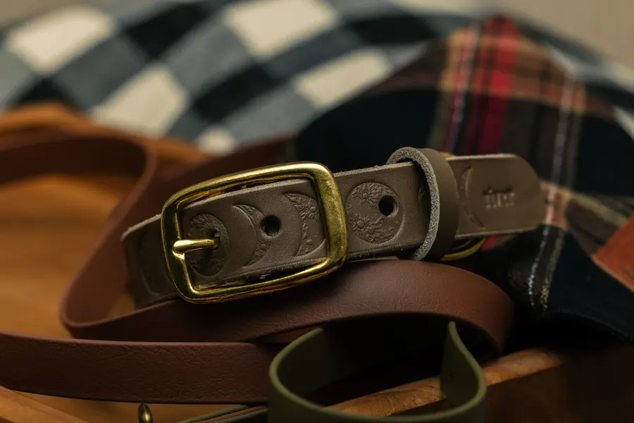 The same collar laid over a wool plaid in warm light.